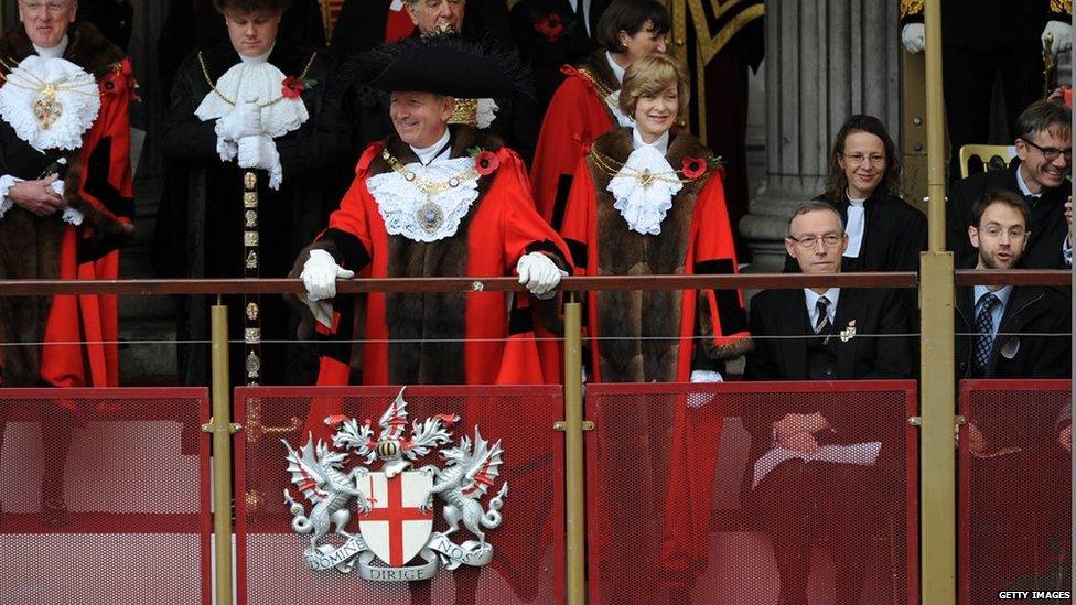 Alan Yarrow, the new Lord Mayor Of London and Fiona Woolf, the previous Lord Mayor, greet the crowd during the annual Lord Mayors Show