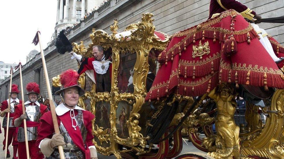 Alan Yarrow, the new Lord Mayor waves to the crowds during the Lord Mayor"s Show in the City of London.