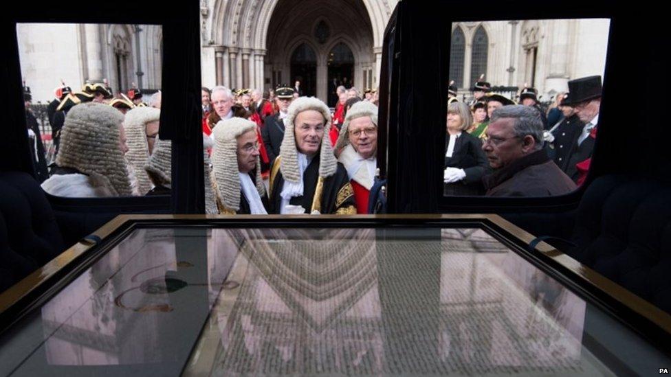 Judges look at the City of London"s 1297 Magna Carta as it travels through the City of London as part of the Lord Mayors Show