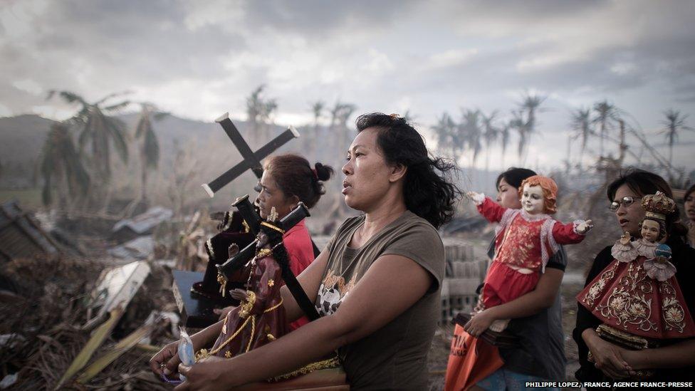 Survivors of typhoon Haiyan march during a religious procession in Tolosa, on the eastern island of Leyte