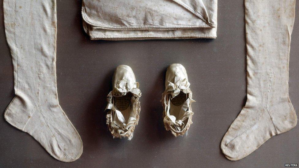 Stockings and slippers belonging to Napoleon II, known as the Roi de Rome, the son of French Emperor Napoleon Bonaparte, are displayed at the Osenat auction house in Paris October 24, 2014.