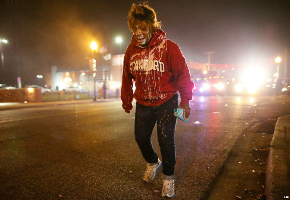 A protestor dazed by the effects of tear gas walks the streets of Ferguson - 24 November 2014