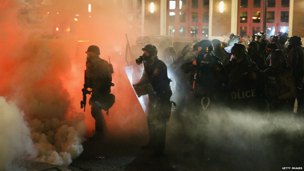 Tear gas spews out of canisters fired by police in Ferguson - 25 November 2014