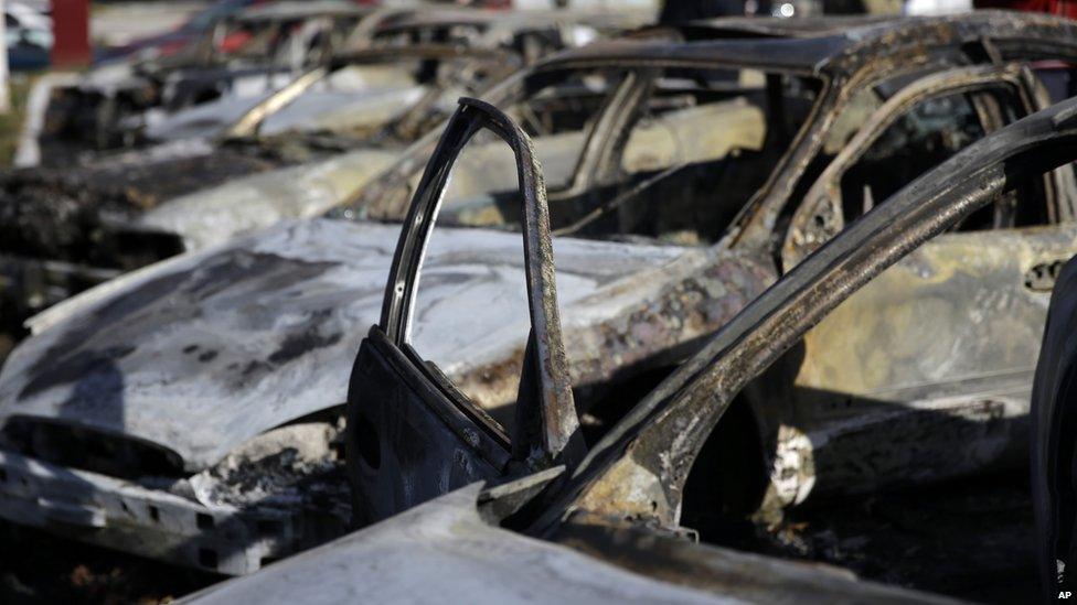 Ferguson: A row of burned cars sit on the lot of a used car dealer Tuesday, Nov. 25, 2014