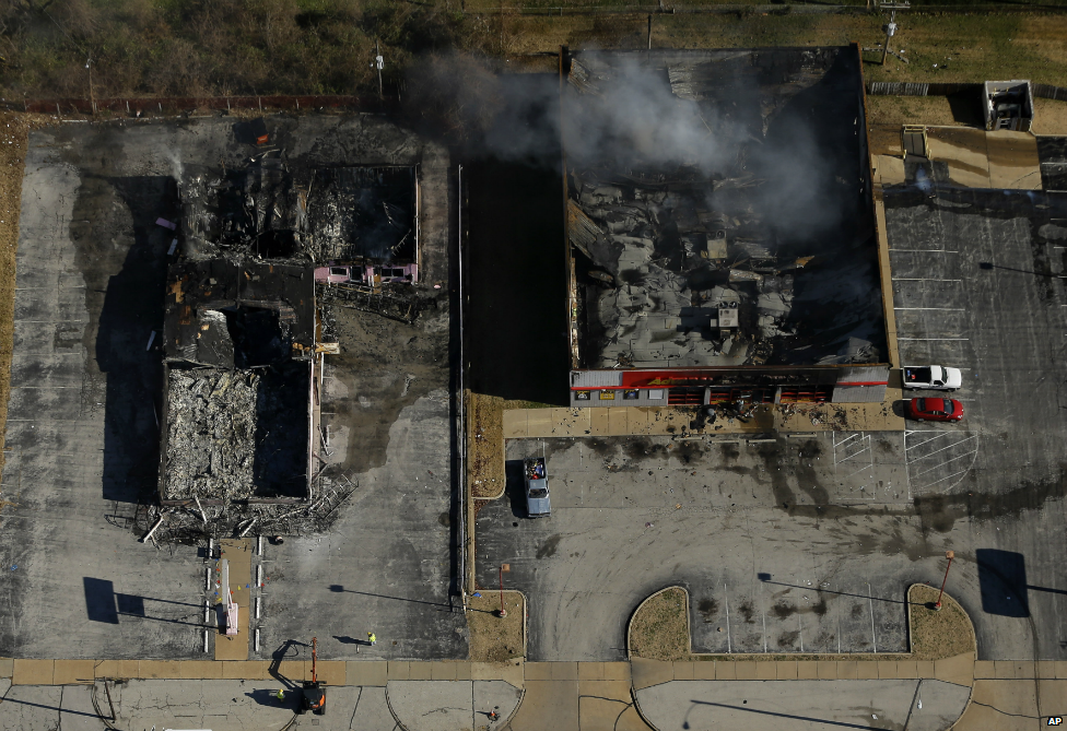 An image captured by a helicopter showing two buildings in Ferguson, Missouri, that were set alight - 25 November 2014