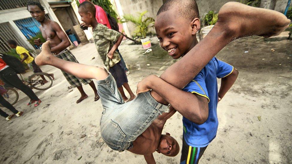 Children playing at acrobatic tricks