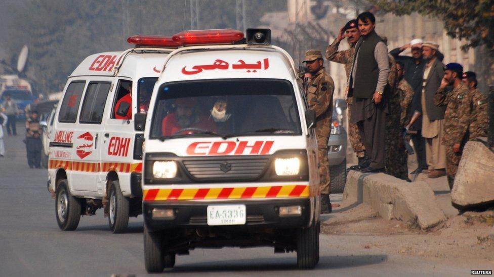 Ambulances near a school which was attacked by gunmen in Peshawar