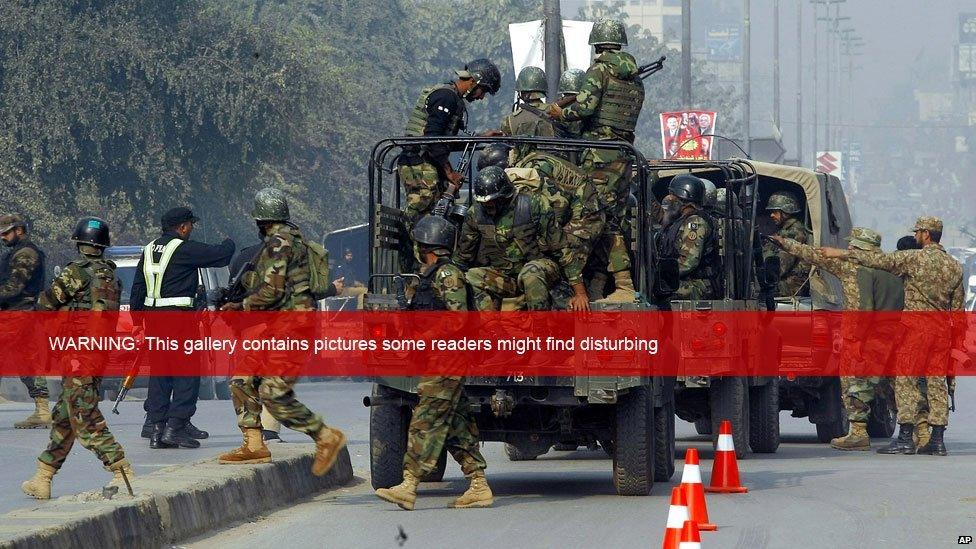 Pakistani army troops arrive at the scene of an armed incident in Peshawar