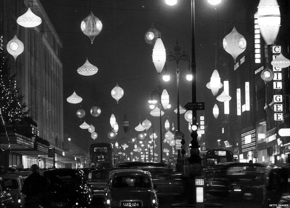 24th November 1961: Christmas decorations decorate Oxford Street, London.