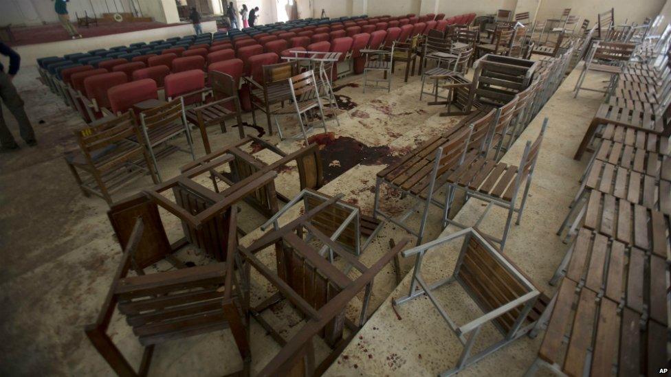 Chairs upturned and blood on the floor at the army school auditorium following the Taliban attack in Peshawar - 17 December 2014