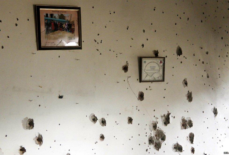 A picture hangs on a bullet ridden wall of the school in Peshawar - 17 December 2014