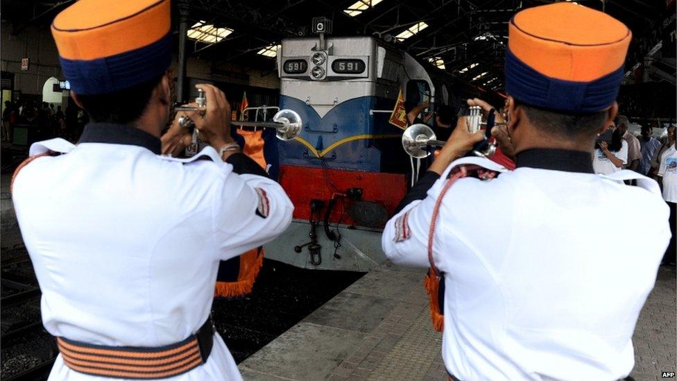 A Sri Lankan honour band play as the Ocean Queen Express sets off from the Colombo railway station. Photo: 26 December 2014