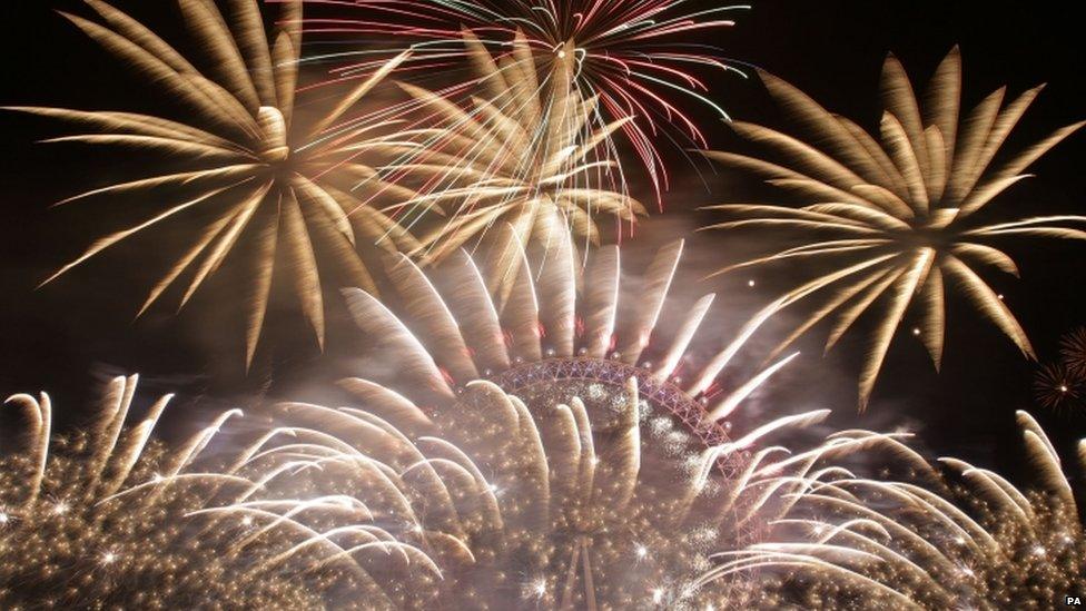 Fireworks light up the sky over the London Eye in central London during the New Year celebrations (01 January 2015)
