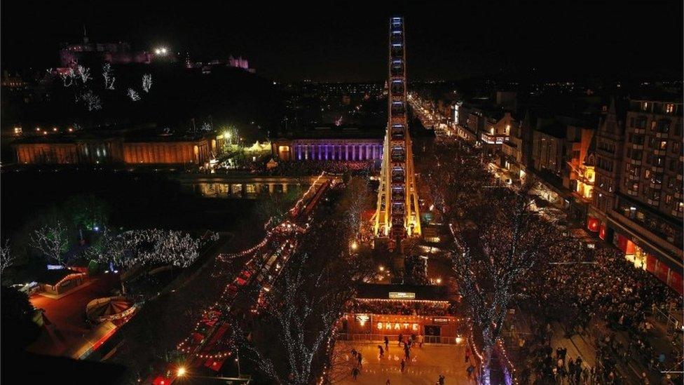 Revellers gather in Princes Street, Edinburgh, to see in the new year