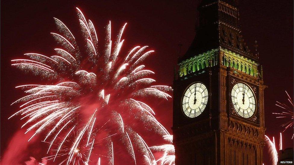 Fireworks explode behind the Houses of Parliament and Big Ben on the River Thames during New Year"s celebrations in London January 1, 2015