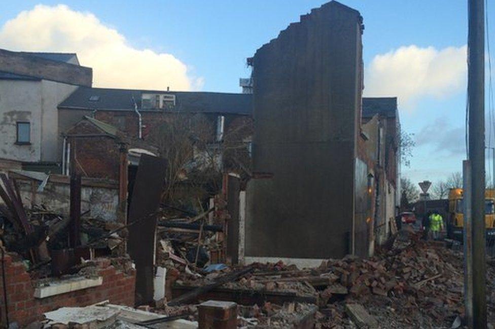 Strong winds knocked down a gable wall on a street off Belfast's Shankill Road