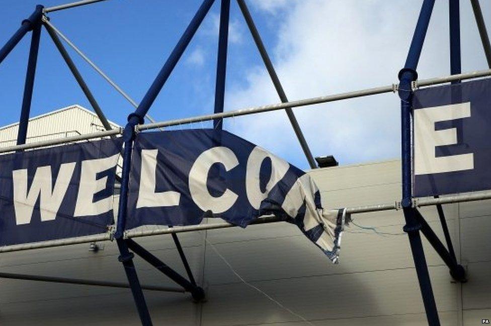 A view of an Everton banner that has partially blown down in the strong winds before the Barclays Premier League match at Goodison Park, Liverpool