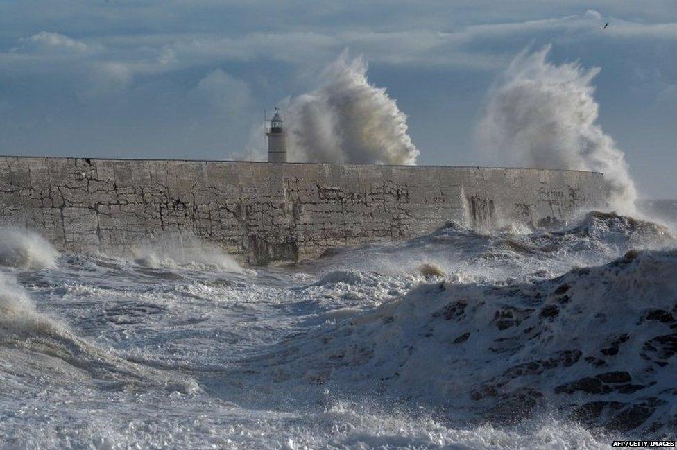 Waves batter the harbour wall in Newhaven on the south coast of England