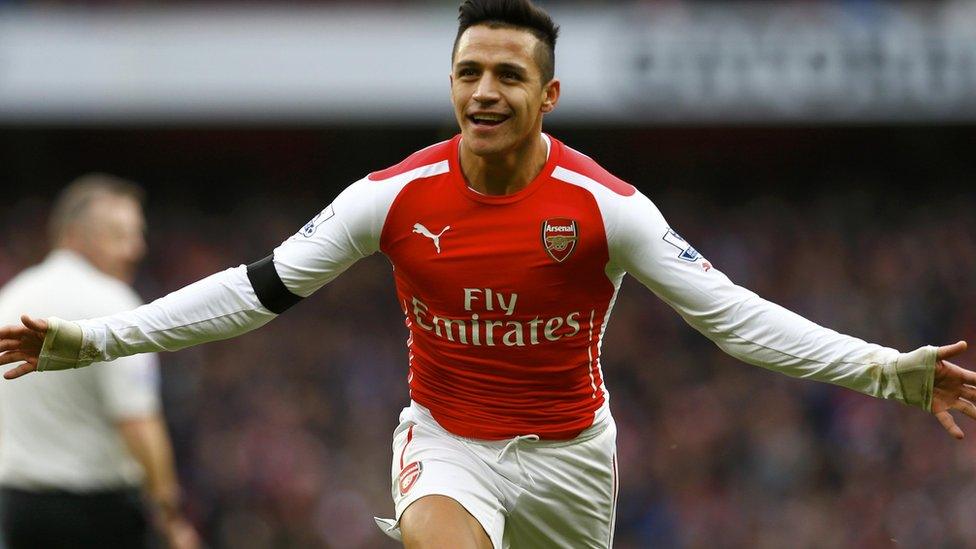 Alexis Sanchez celebrates Arsenal's second goal against Stoke