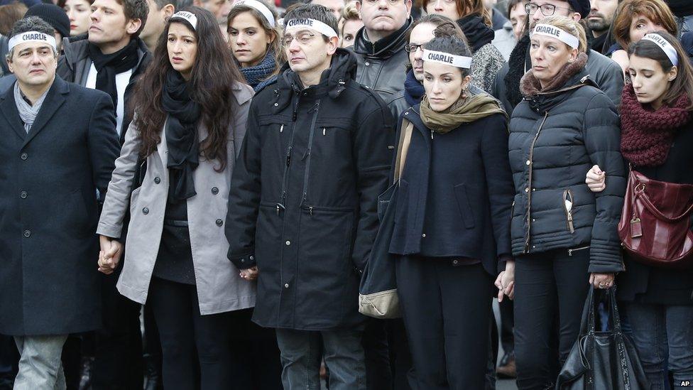 Charlie Hebdo newspaper staff march in Paris