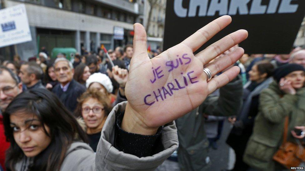 Woman with Je Suis Charlie written on her hand