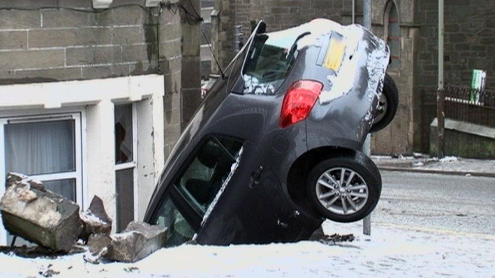 A six-car accident left one driver with minor injuries and nose-first in a house in Dundee.