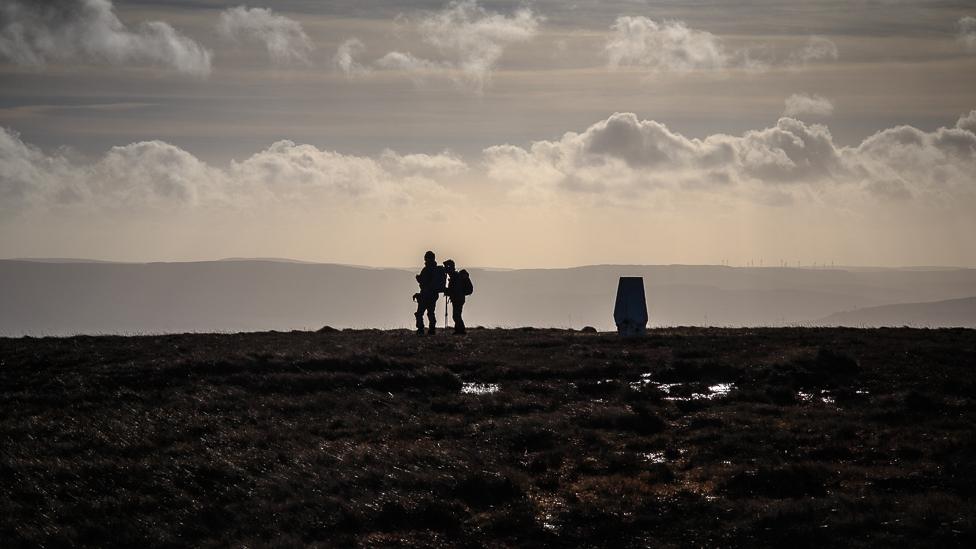 Walkers at the summit of Fan Gyhirych in the Brecon Beacons at New year, by Nick Dallimore