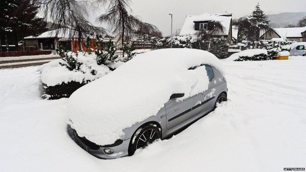 Snow covered cars in Tyndrum