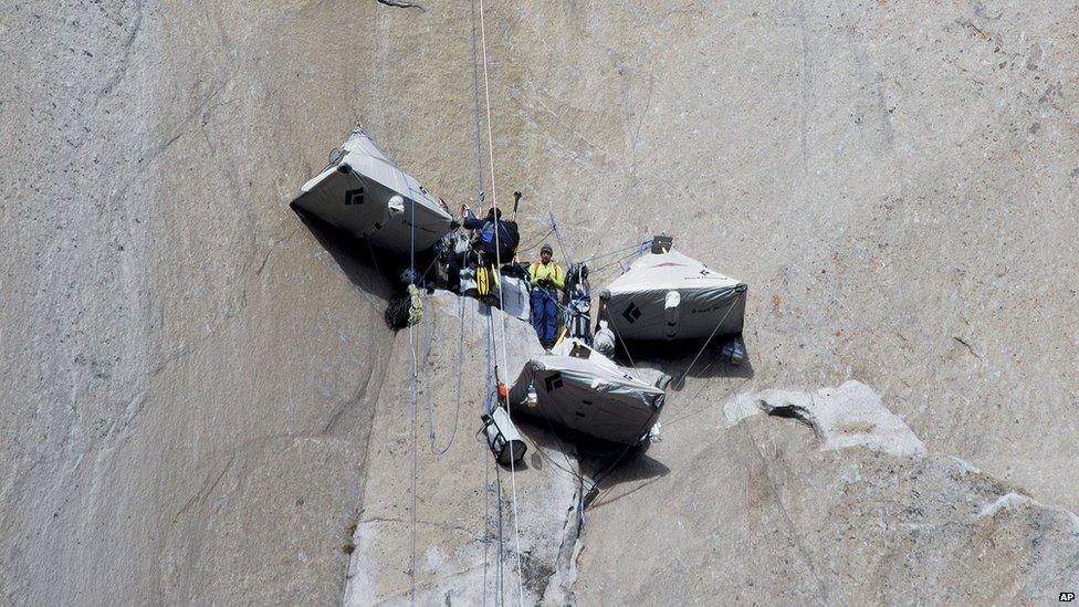 Climbers' tents hanging from a rock face