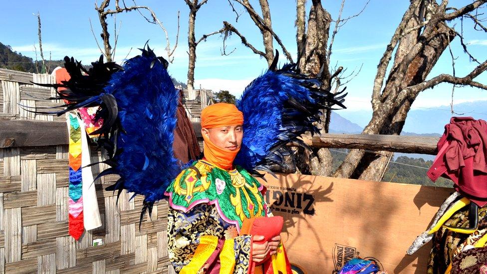 bhutan dancer with wings