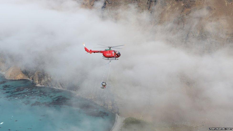 Helicopter spreading rat bait on South Georgia (c) Tony Martin/SGHT