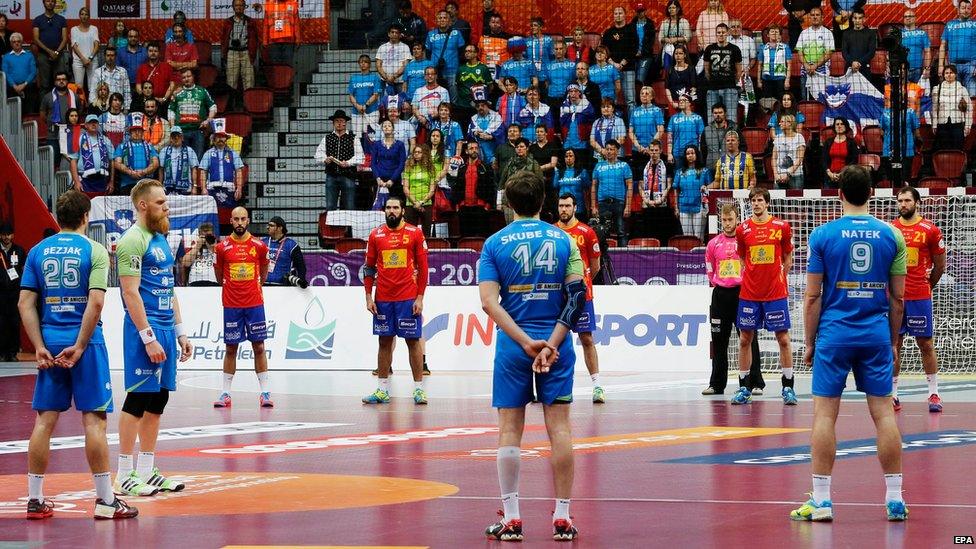 Players and spectators observe a minute of silence for King Abdullah of Saudi Arabia before the Qatar 2015 24th Men's Handball World Championship match between Spain and Slovenia at the Duhail Handball Sports Hall in Doha, Qatar, on 23 January 2015