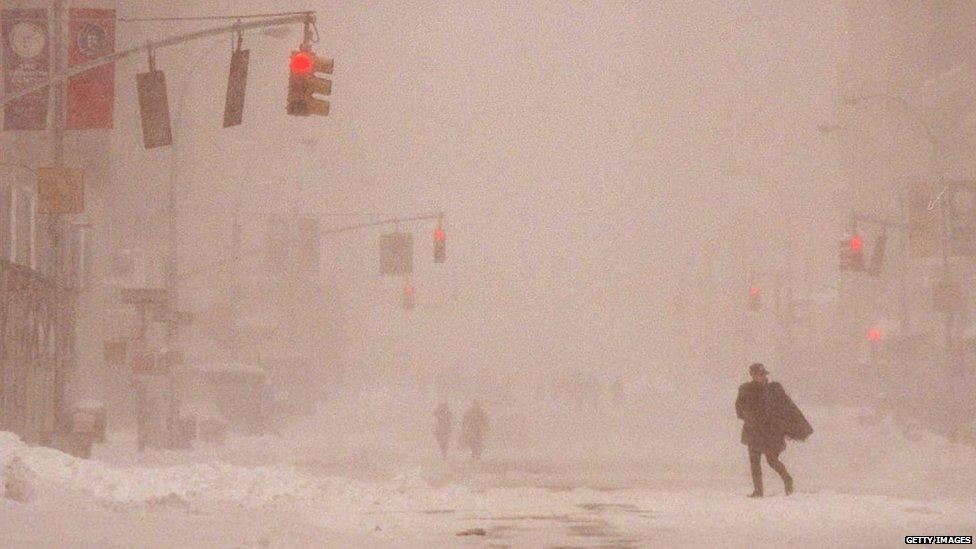 New Yorker makes her way down Seventh Avenue in Manhattan in 1996 during a blizzard that shut down airports and caused the mayor to declare a state of emergency.