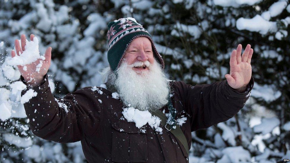Man playing in the snow
