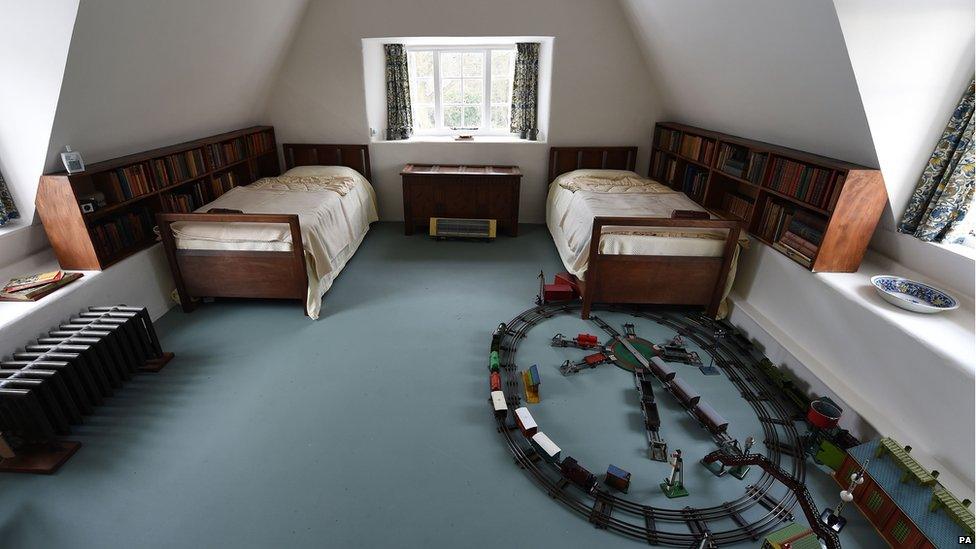 Electric train set on the bedroom floor at Stoneywell