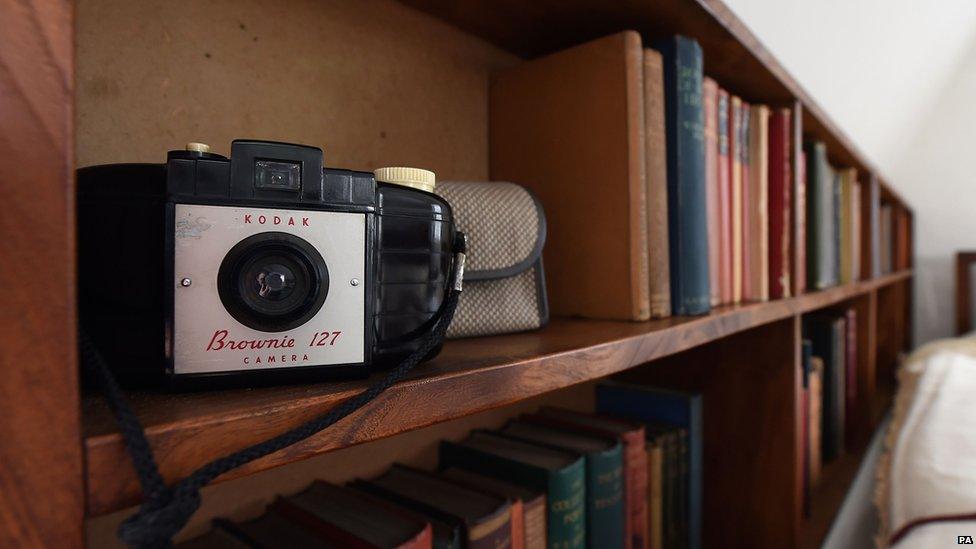 A Kodak camera on the bookshelf in a bedroom at Stoneywell