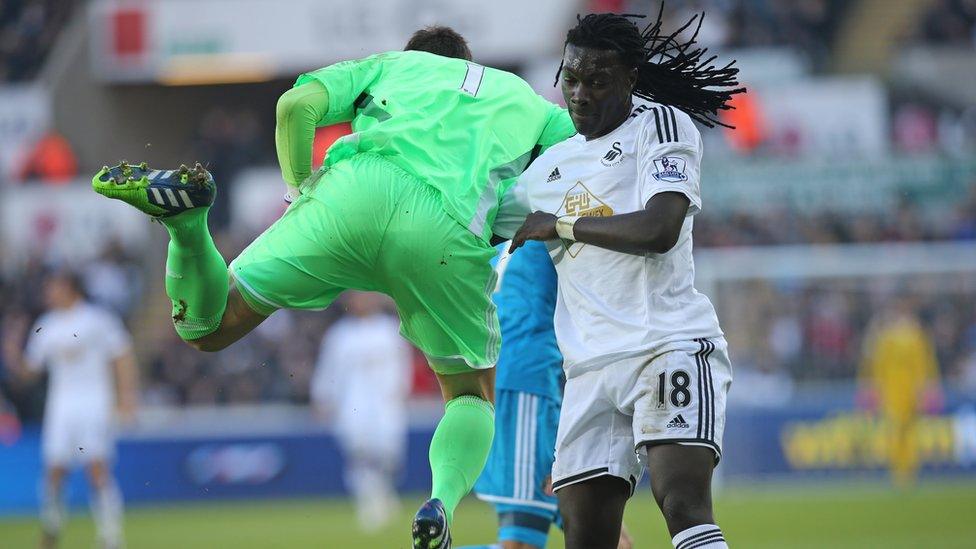 Sunderland's Costel Pantilimon is challenged by Swansea's Bafetimbi Gomis
