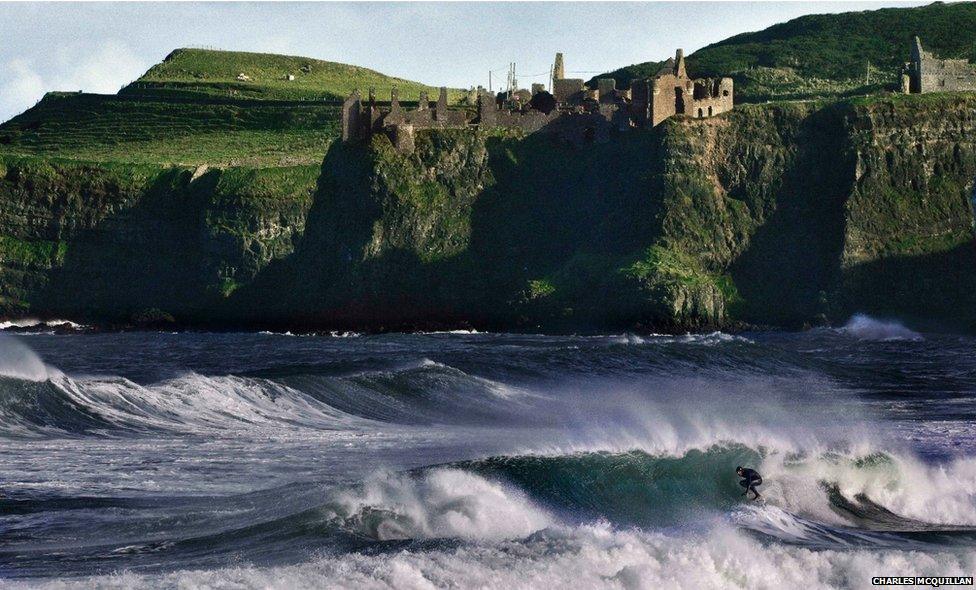 Alastair Mennie, surfing near Dunluce Castle