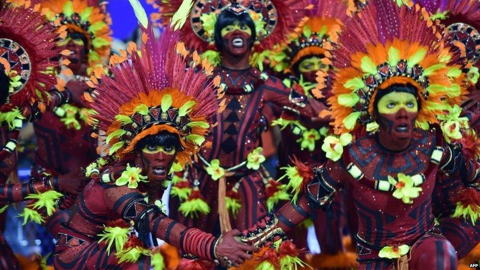 Revellers of the Salgueiro samba school perform during the first day of carnival parade at the Sambadrome in Rio de Janeiro on 16 February 2015