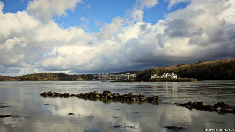 Menai Bridge, Ynys Gored Goch and the fish traps at high tide on the Menai Strait at Anglesey by Bleddyn Jones-Pearson.