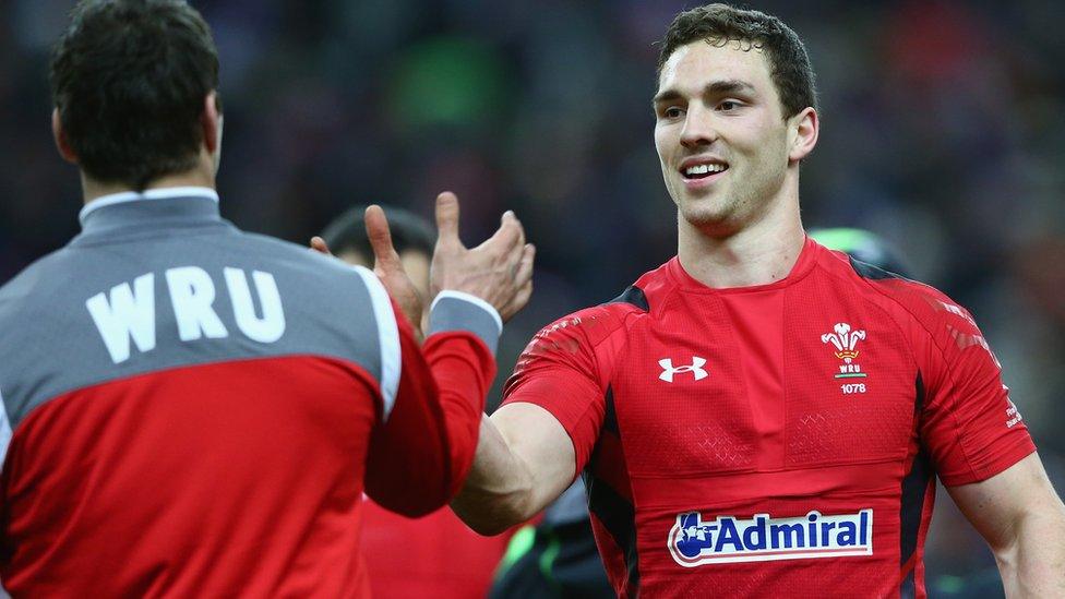 Mike Phillips and George North celebrate for Wales