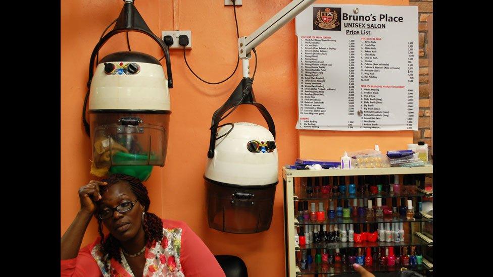 A worker at Bruno's Place hair salon in Ikeja Mall in Lagos, Nigeria