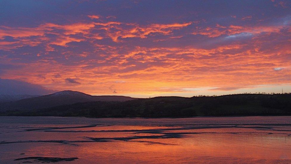 Sunset over the Conwy estuary with Snowdonia National Park in the background, as seen by Pilvi Lassila, from Helsinki, Finland