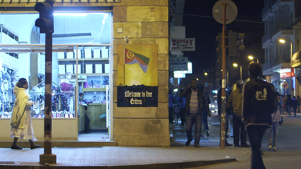 A street in Asmara with a Welcome to Free Eritrea sign