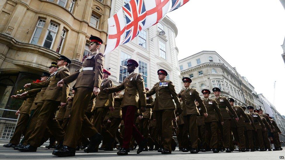 Members of the armed forces marching into the Guildhall