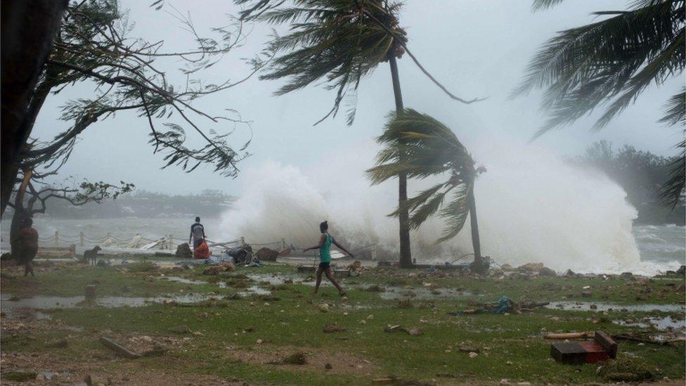 This handout photo taken and received on 14 2015 by Unicef Pacific shows waves and scattered debris along the coast, caused by Cyclone Pam, in the Vanuatu capital of Port Vila