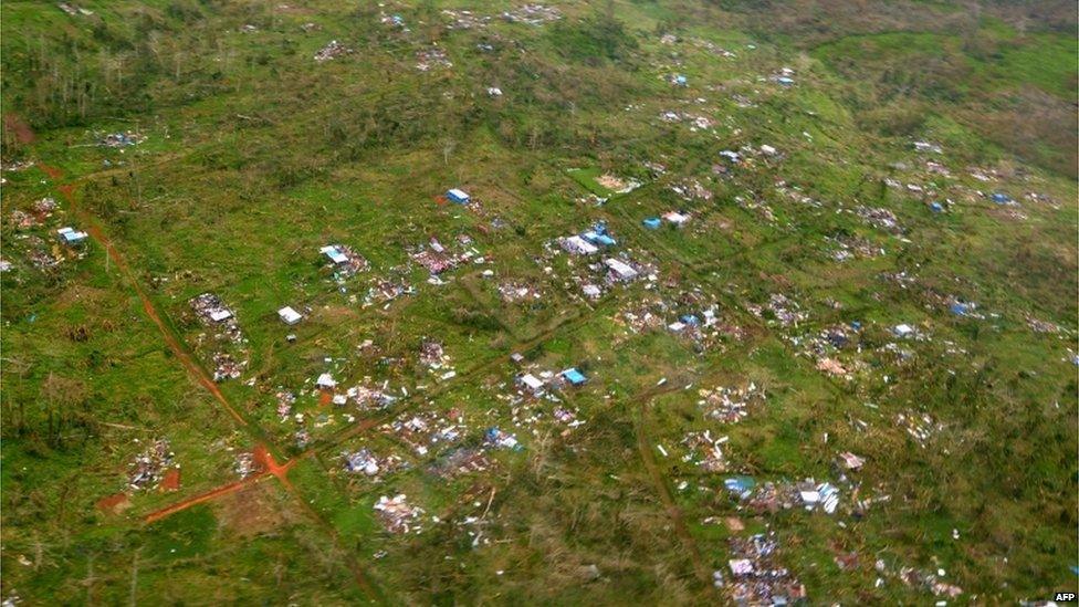 This handout photo taken and received on 15 March 2015 by CARE Australia shows an aerial photo of damage caused by Cyclone Pam on the outskirts of the Vanuatu capital of Port Vila