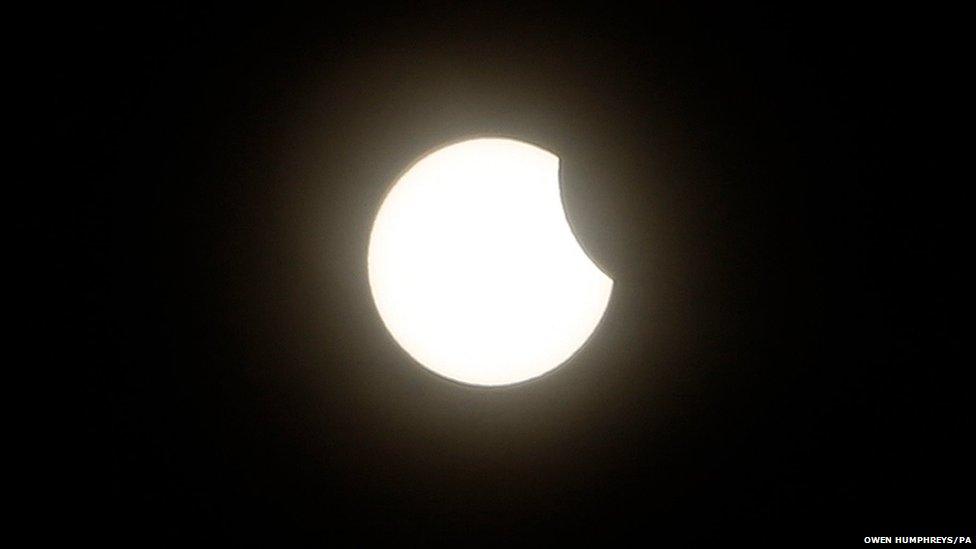 An eclipse of the sun begins over Plymouth in Devon