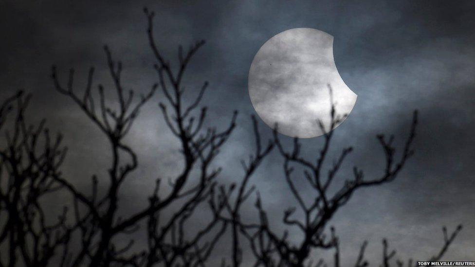 A partial solar eclipse is seen from near Bridgwater, in south western England