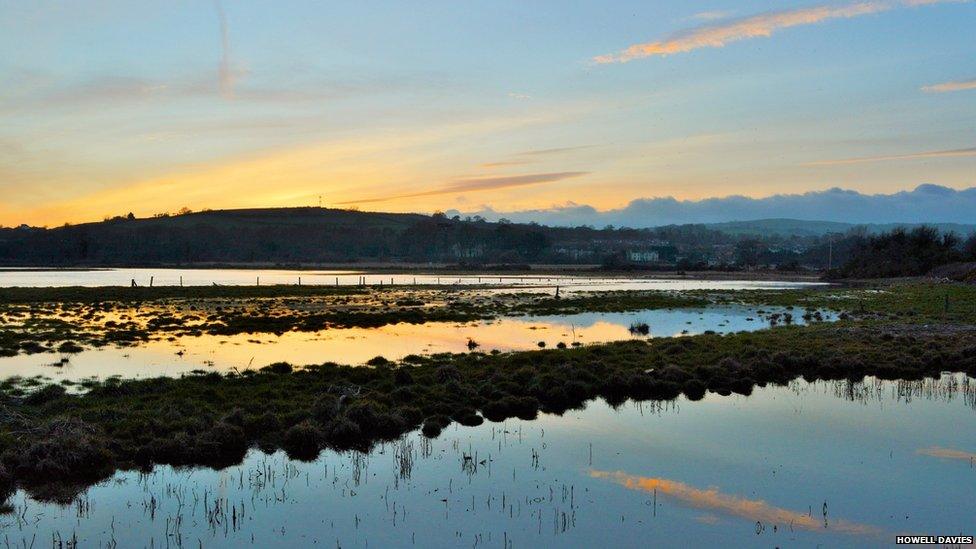 Sunset over the flooding River Loughor at Pontarddulais, during the recent supermoon. Picture by Howell Davies